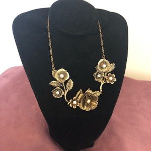 Antique-style brass necklace with pearls